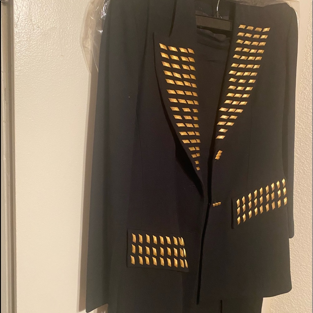 Regine , black polyester suit S-14, trimmed in golden nuggets, midi skirt